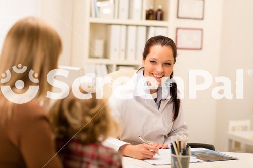 Mother And Child Girl Visit Pediatrician Office Healthcare Specialist